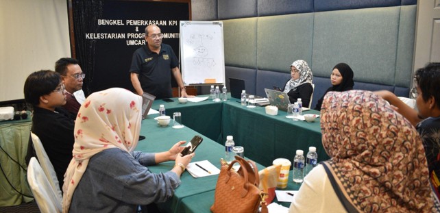 A professional workshop in a conference room setting