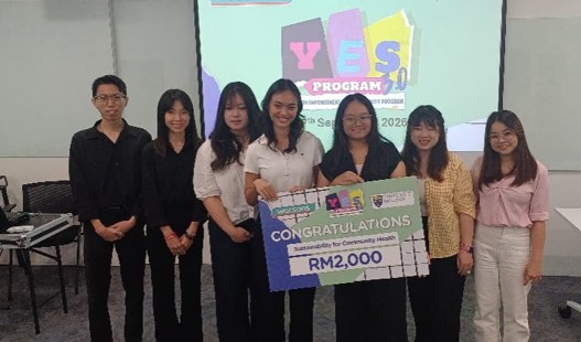 Winning team posing with a large ceremonial cheque